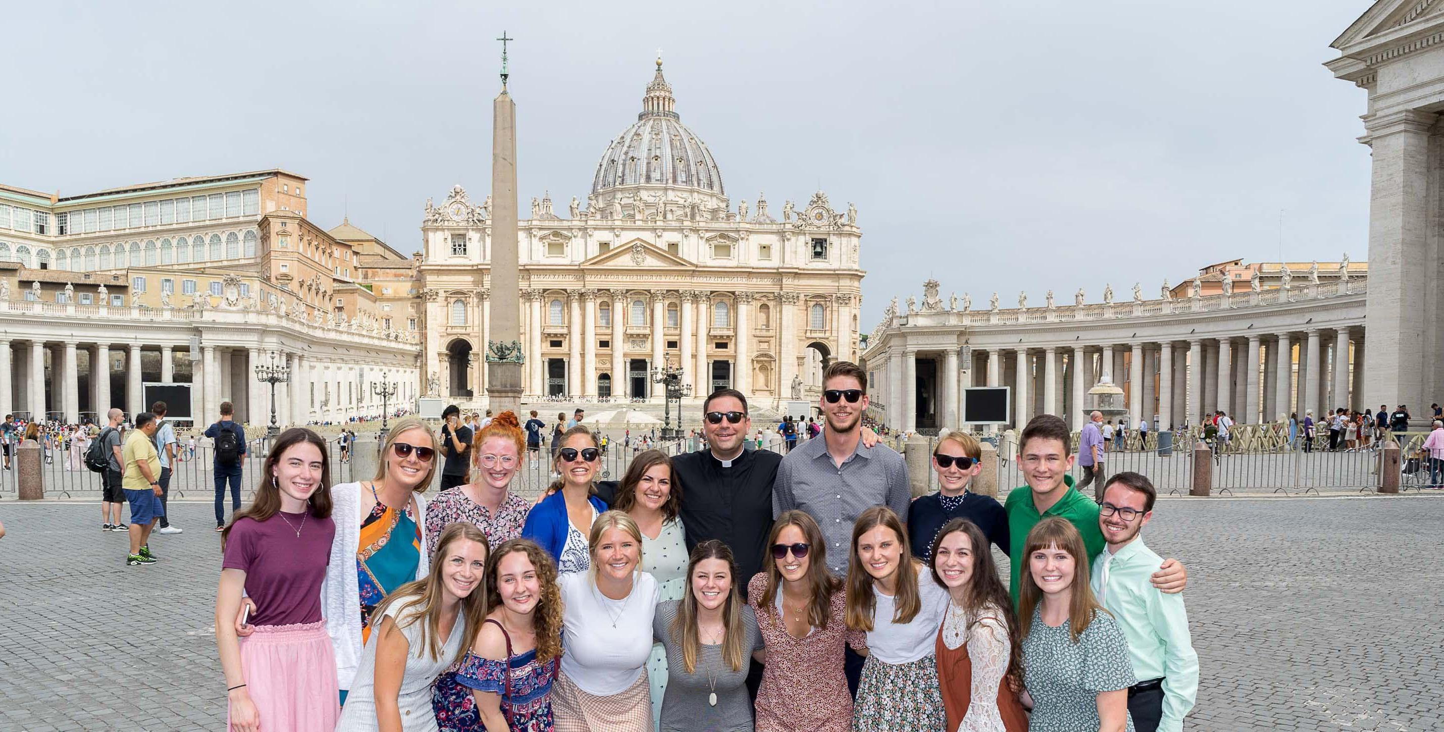 Smiling students in front of St. Peter's Basilica